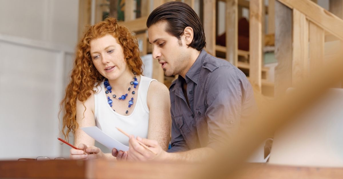 Two people reviewing a CV