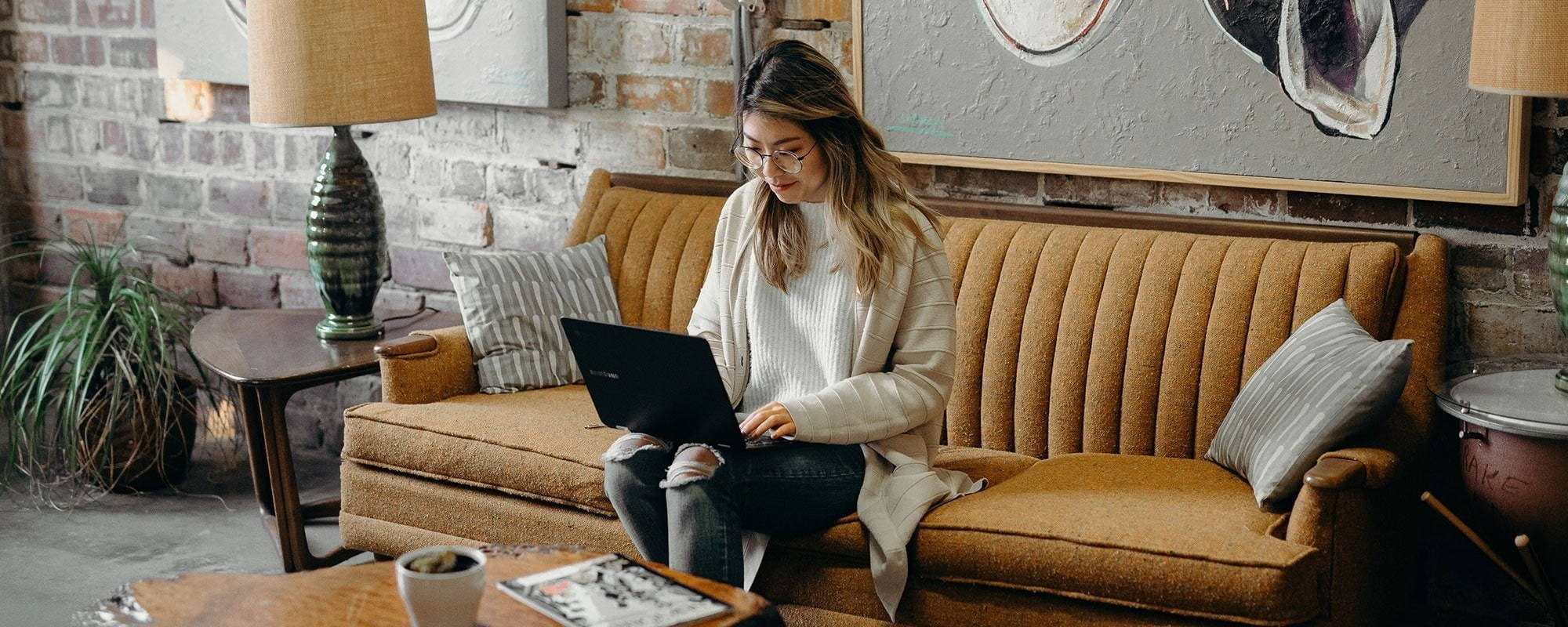 Person working on a sofa