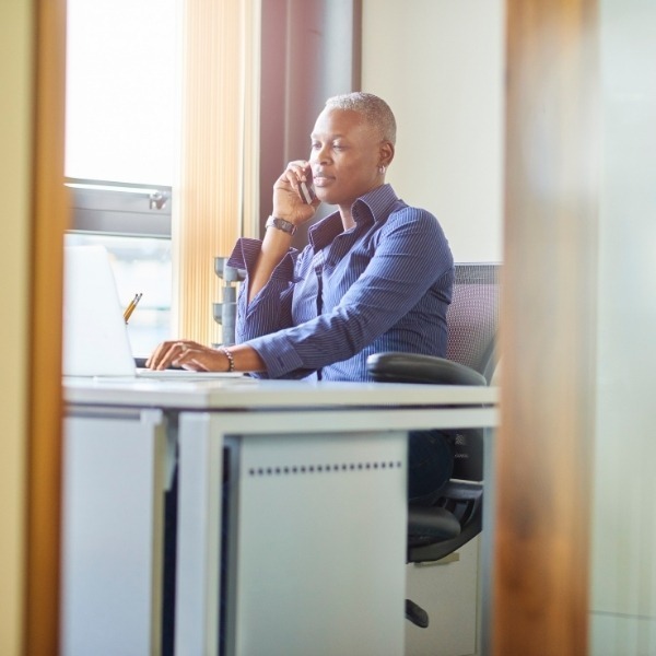 Person on phone in an office