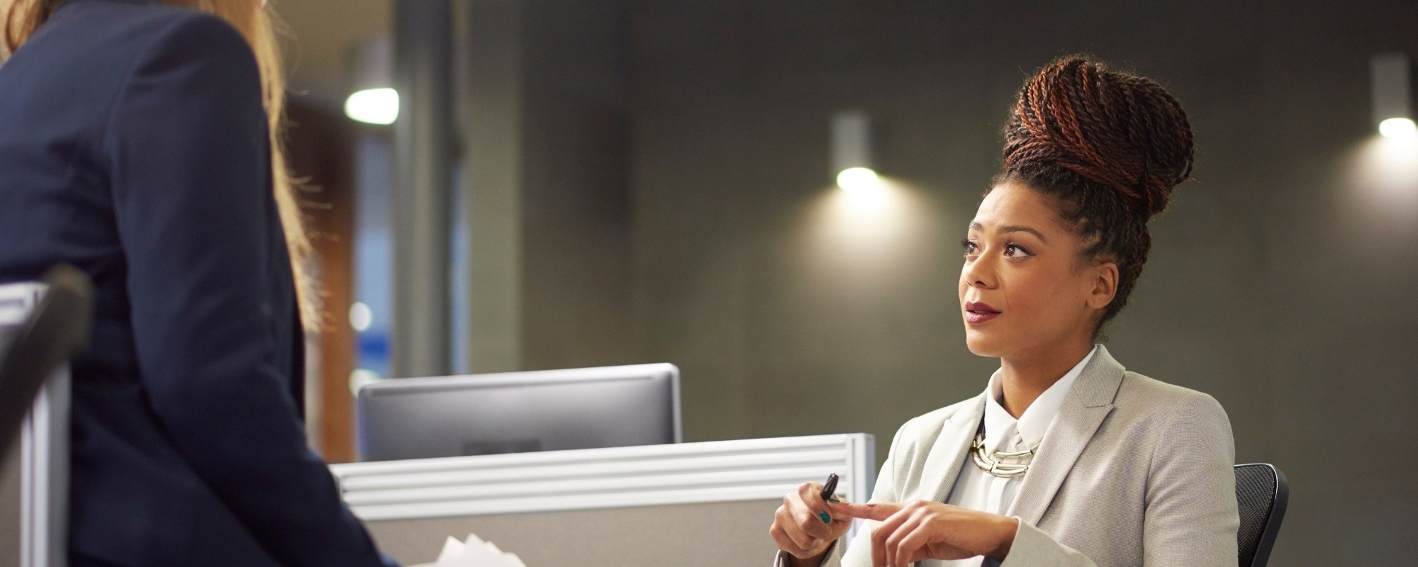 Person having conversation in office