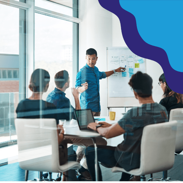 People working at a whiteboard