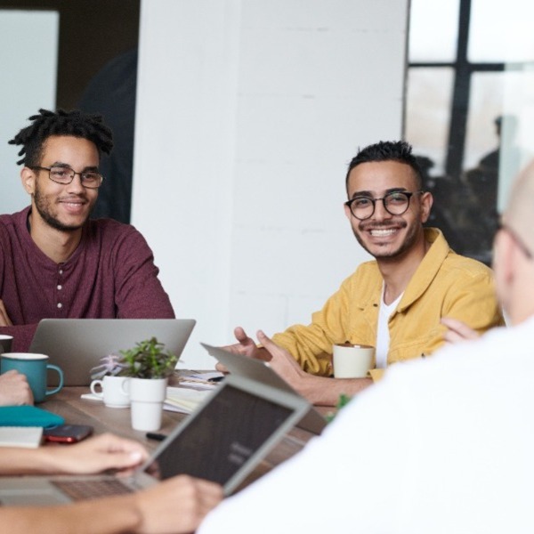 Two people smiling in meeting
