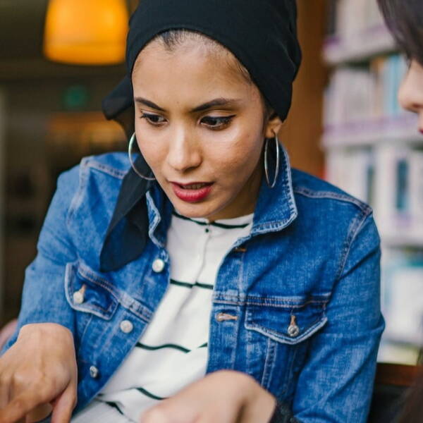 Woman pointing at laptop